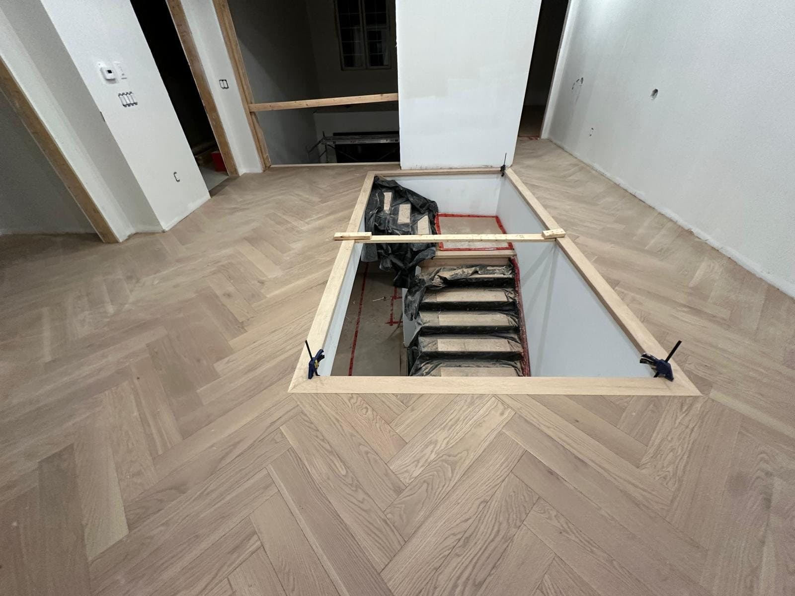 Temporary stair in a freshly cut floor opening during construction